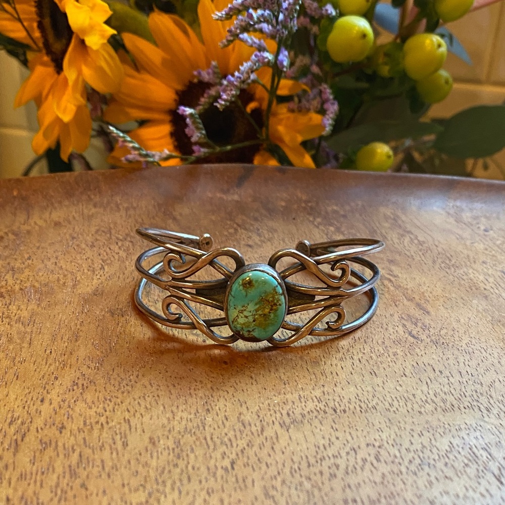 Vintage turquoise and silver tone artisan cuff.